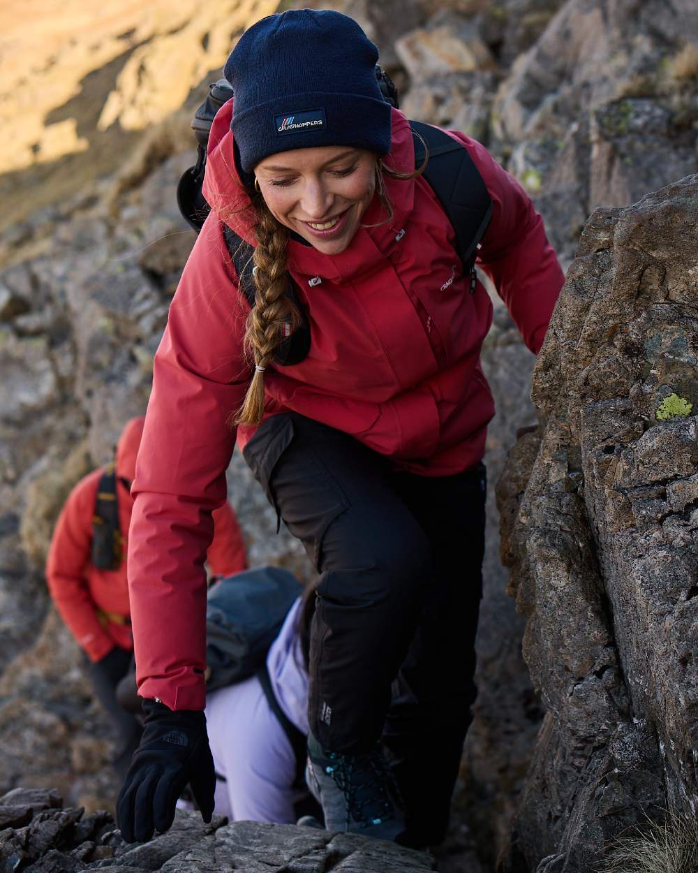 Black coloured Craghoppers Womens Natales Waterproof Lightweight Cargo Trousers on mountain background