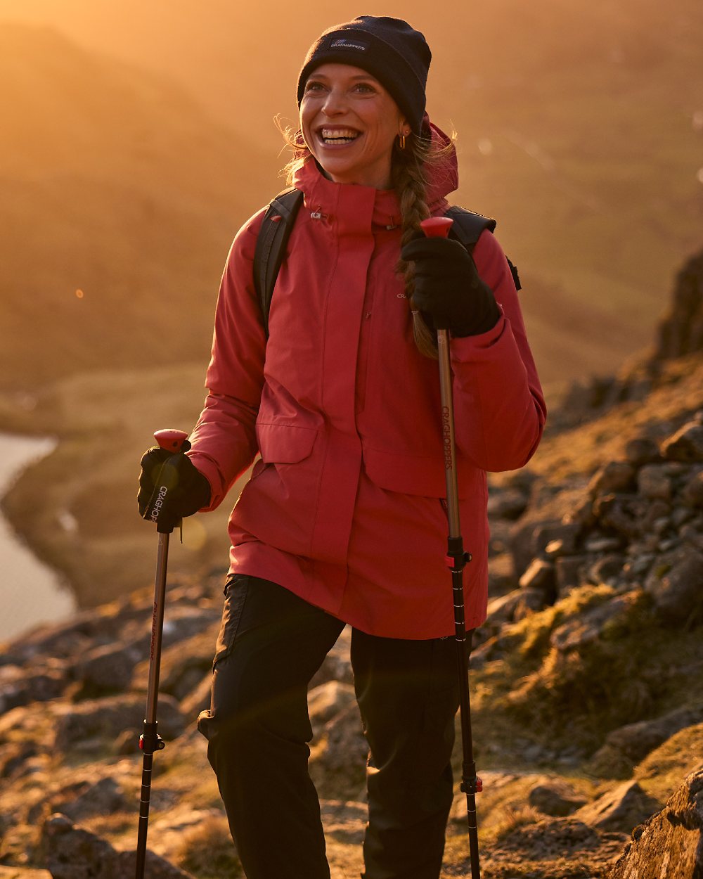 Black coloured Craghoppers Womens Natales Waterproof Lightweight Cargo Trousers on mountain background