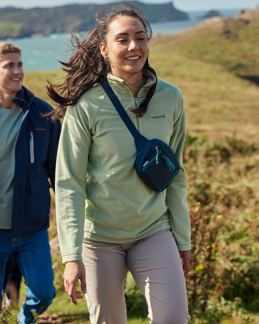 Sage coloured Craghoppers Womens National Trust Miska Half Zip Top on mountain background