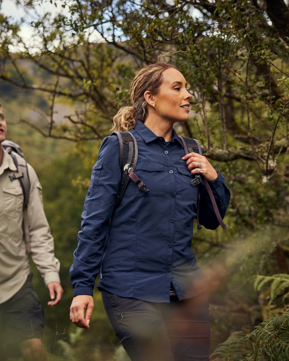 Blue Navy coloured Craghoppers Womens NosiLife Adventure Long Sleeved Shirt III on forest background