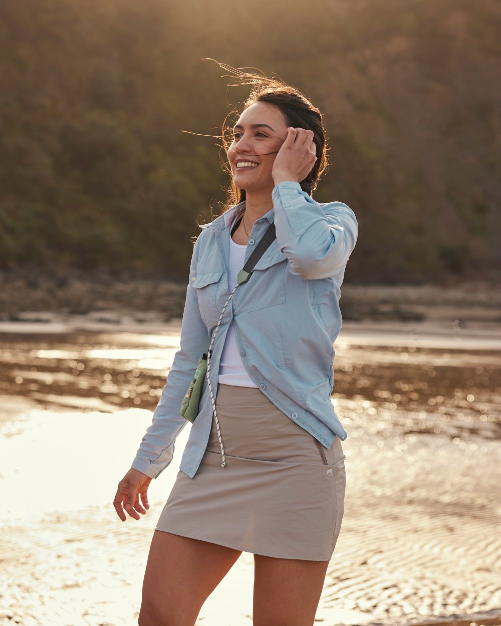 Nimbus Blue coloured Craghoppers Womens NosiLife Adventure Long Sleeved Shirt III on beach background