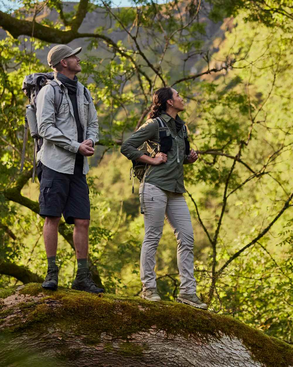 Wild Olive coloured Craghoppers Womens NosiLife Adventure Long Sleeved Shirt III on forest background