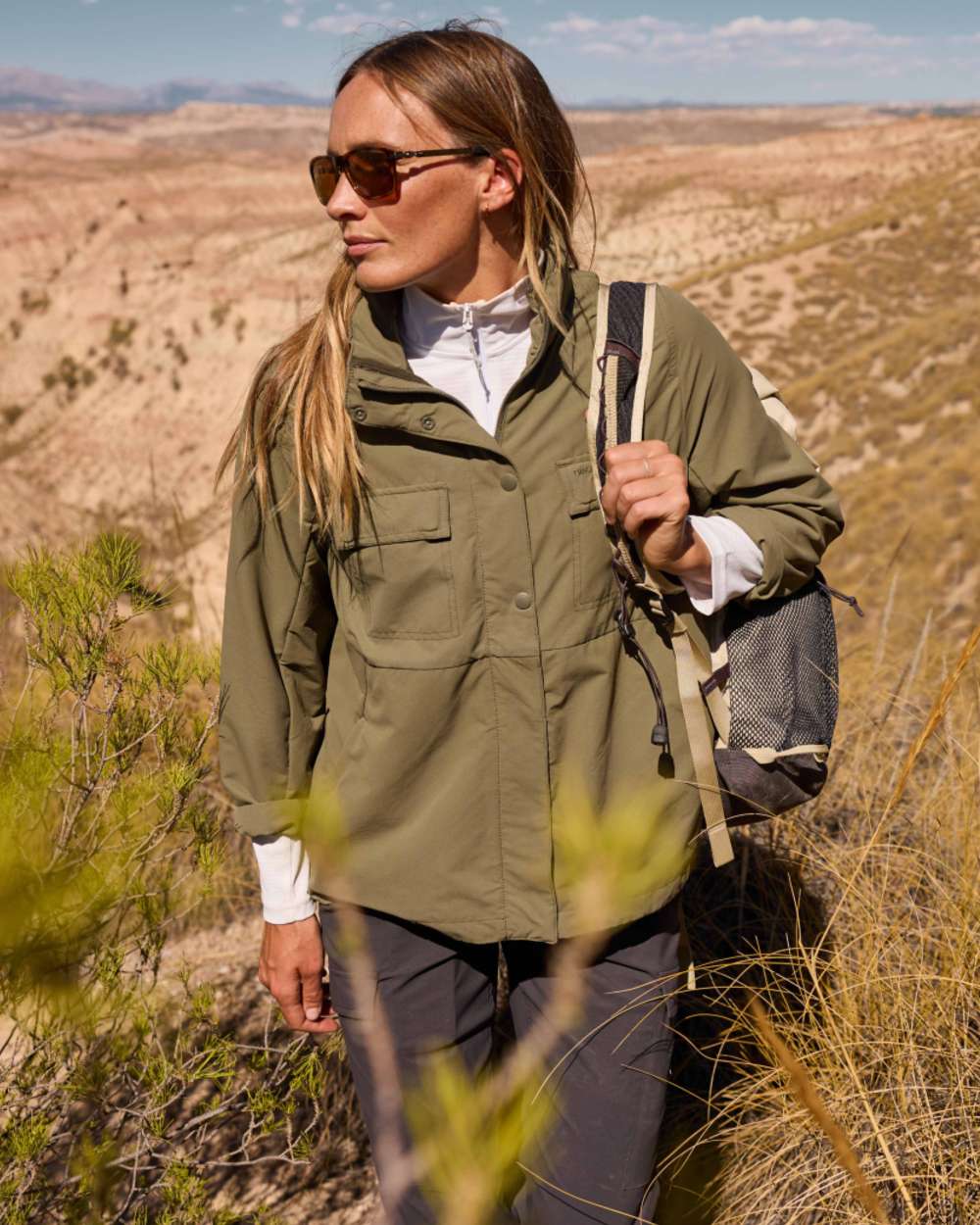 Wild Olive coloured Craghoppers Womens NosiLife Farah Jacket on mountain background