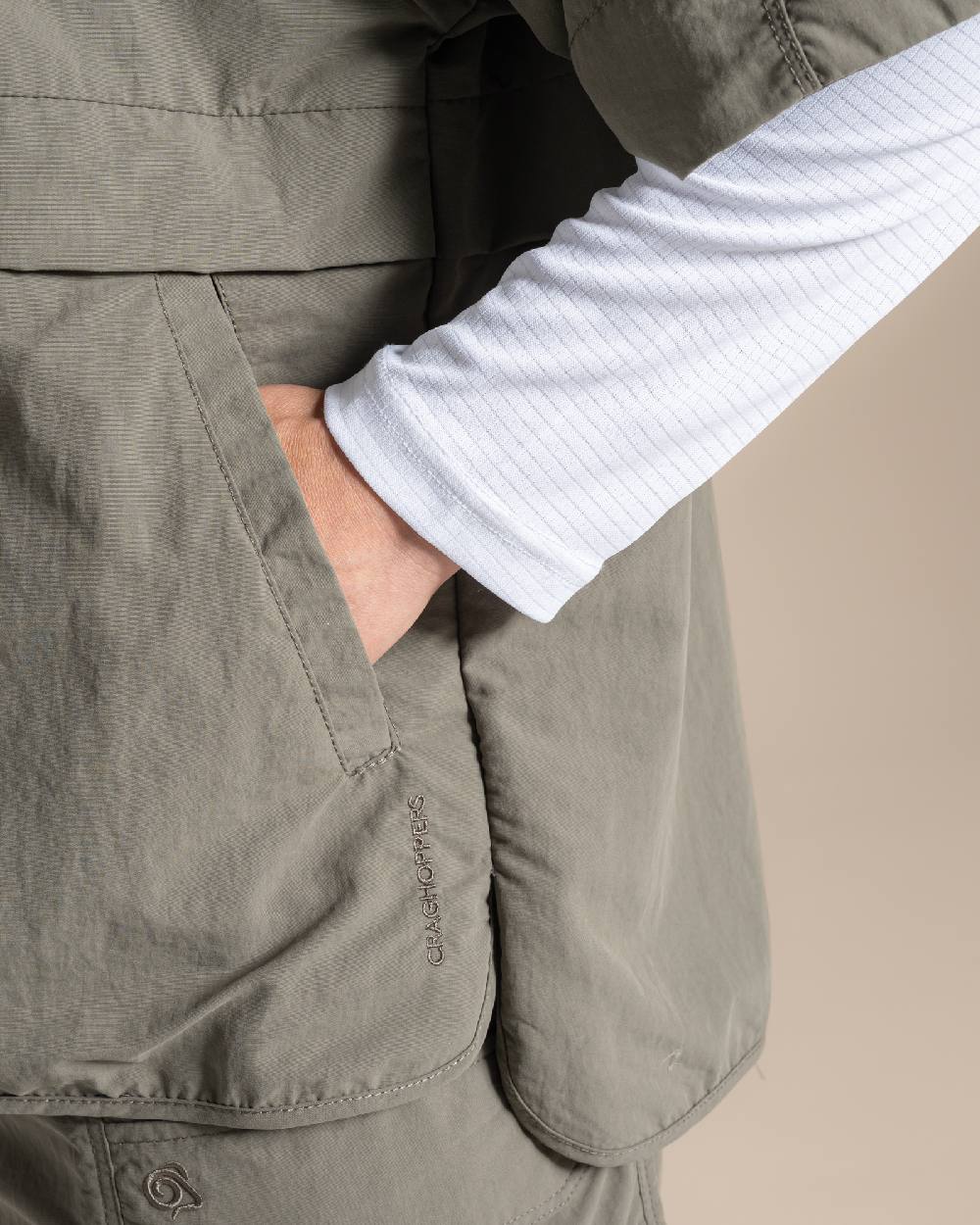 Wild Olive Coloured Craghoppers Womens Nosilife Medina Short Sleeved Overhead Shirt on Beige Background