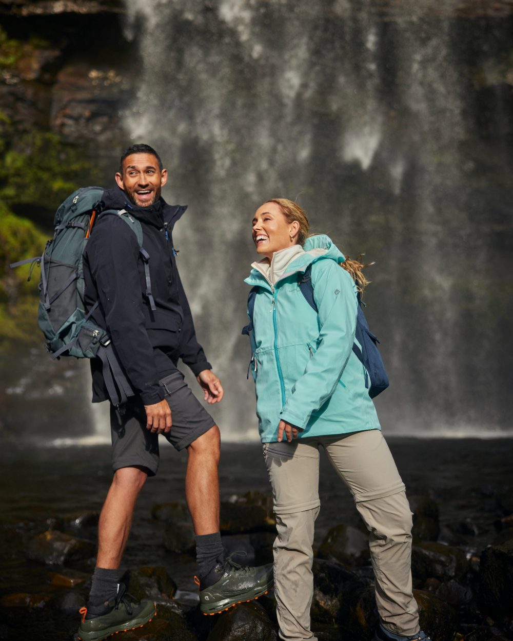 Soft Mushroom coloured Craghoppers Womens NosiLife Pro Convertible Trousers on waterfall background