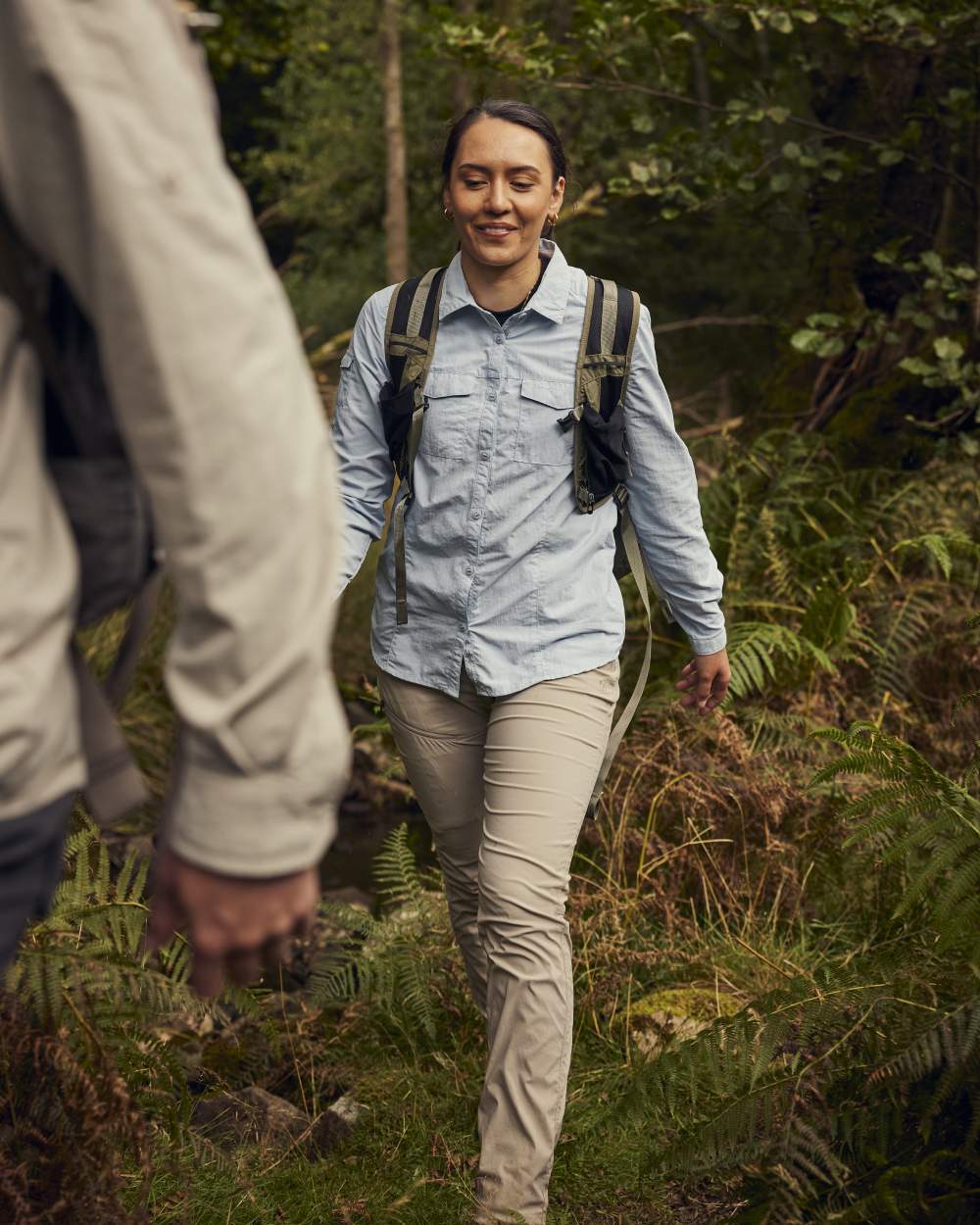 Soft Mushroom coloured Craghoppers Womens NosiLife Pro Trousers III on forest background