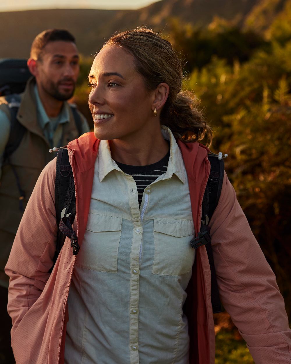 Red Sandstone Clay coloured Craghoppers Womens NosiLife Rosa Reversible Jacket on mountain background