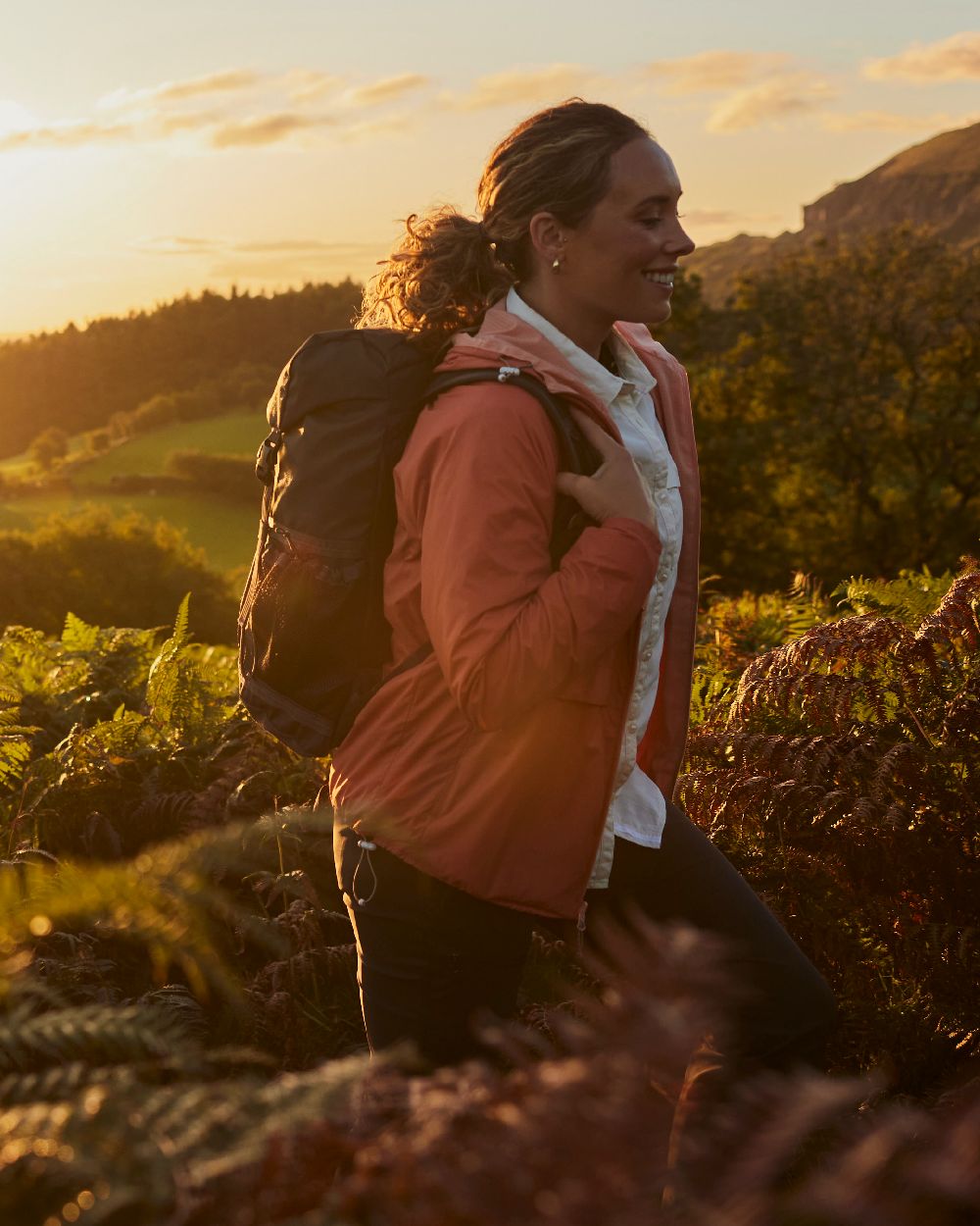 Red Sandstone Clay coloured Craghoppers Womens NosiLife Rosa Reversible Jacket on garden background