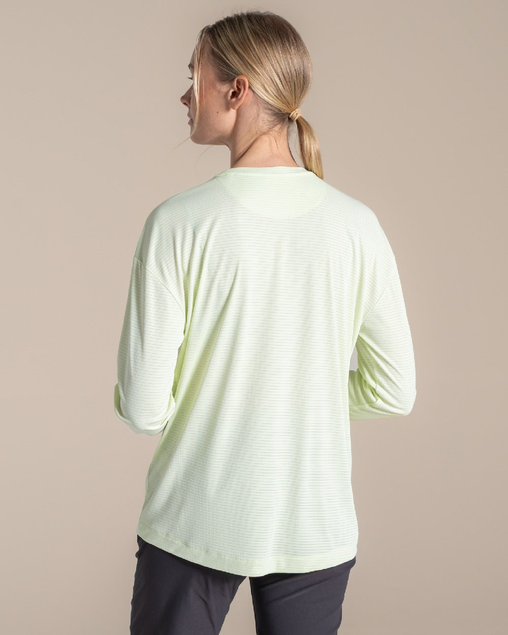 Pear Drop coloured Craghoppers Womens NosiLife SolarShield+ Long Sleeved T-Shirt on beige background