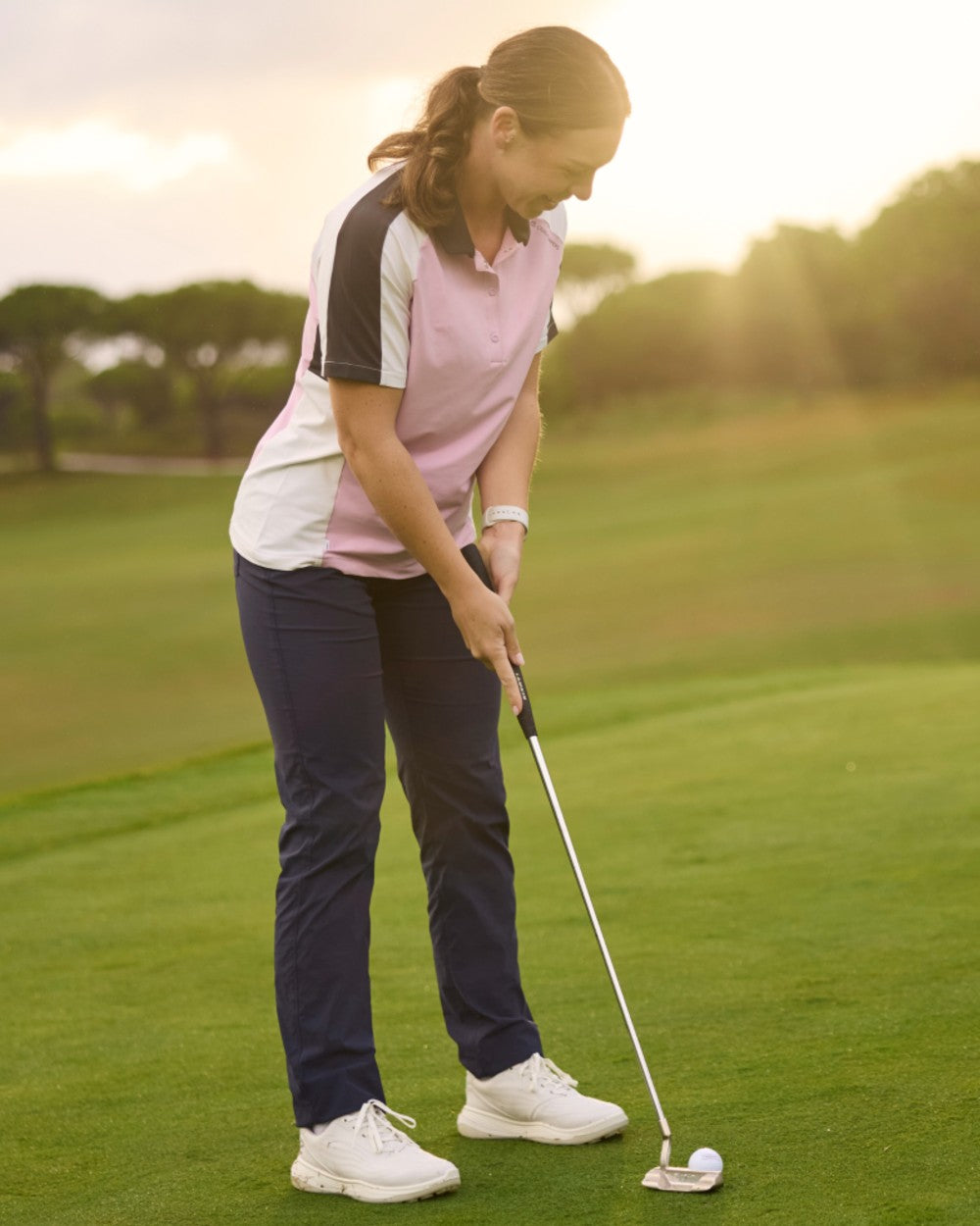 Blue Navy coloured Craghoppers Womens Nosilife Milla Golf Trousers on grass background