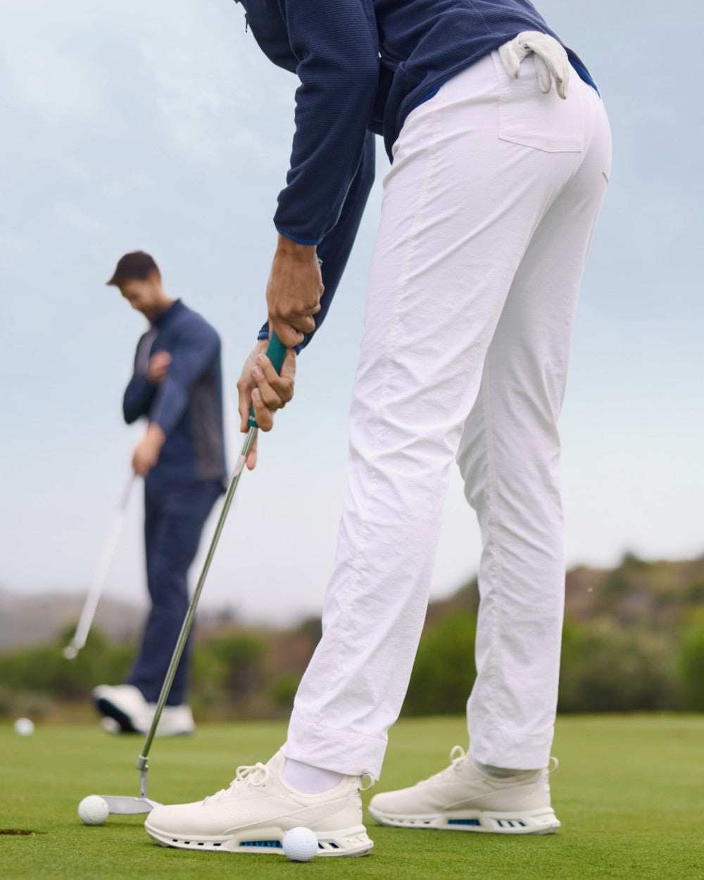 White coloured Craghoppers Womens Nosilife Milla Golf Trousers on grass background