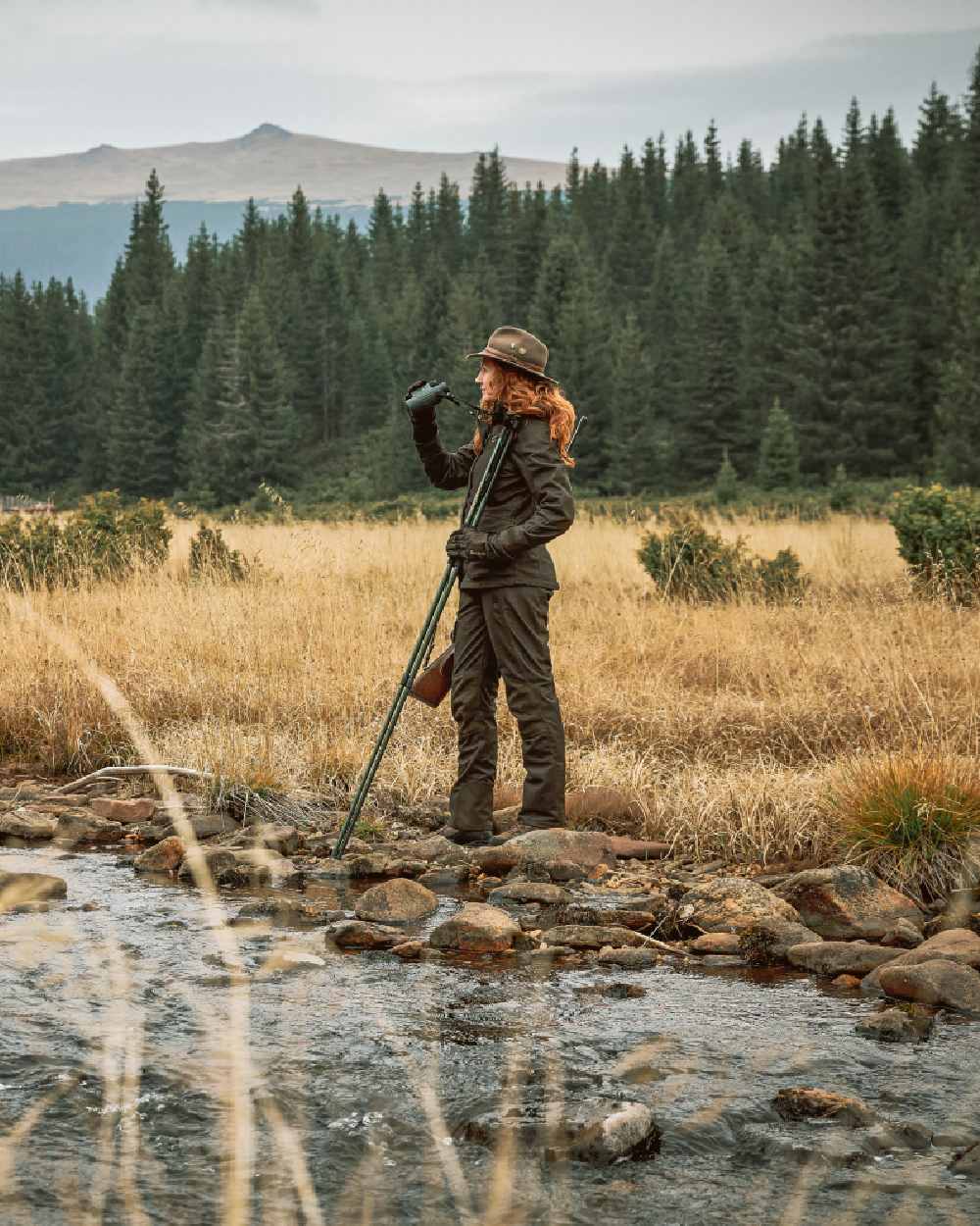 Green Coloured Deerhunter Adventurer Felt Hat on forest background