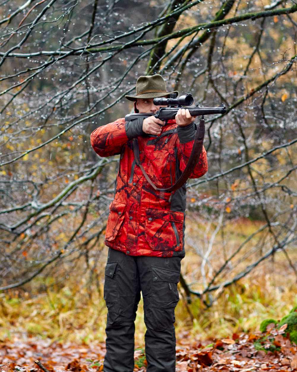 Green Coloured Deerhunter Adventurer Felt Hat on forest background