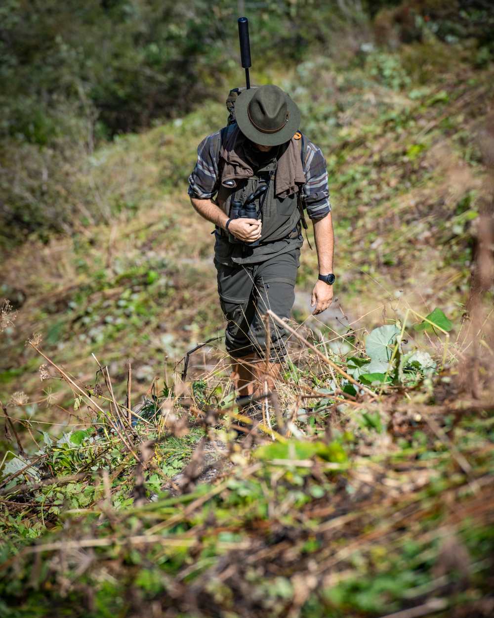 Green Coloured Deerhunter Adventurer Felt Hat on forest background