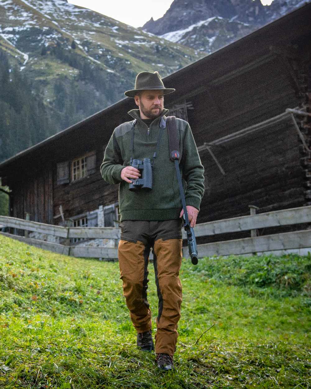 Green Melange coloured Deerhunter Carlisle Knit with Stormliner Zip Neck Sweater on grass background