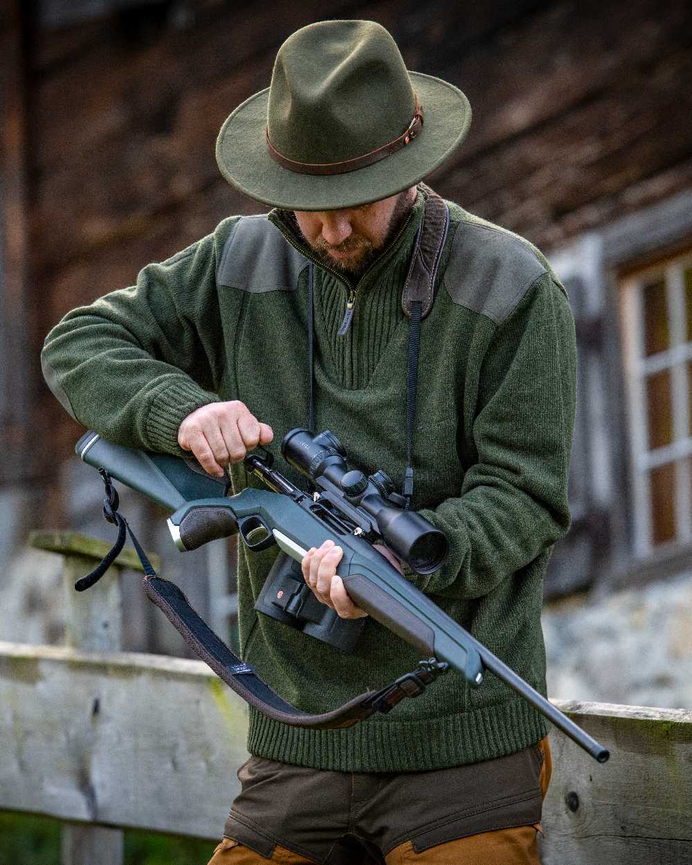 Green Melange coloured Deerhunter Carlisle Knit with Stormliner Zip Neck Sweater on blurry background