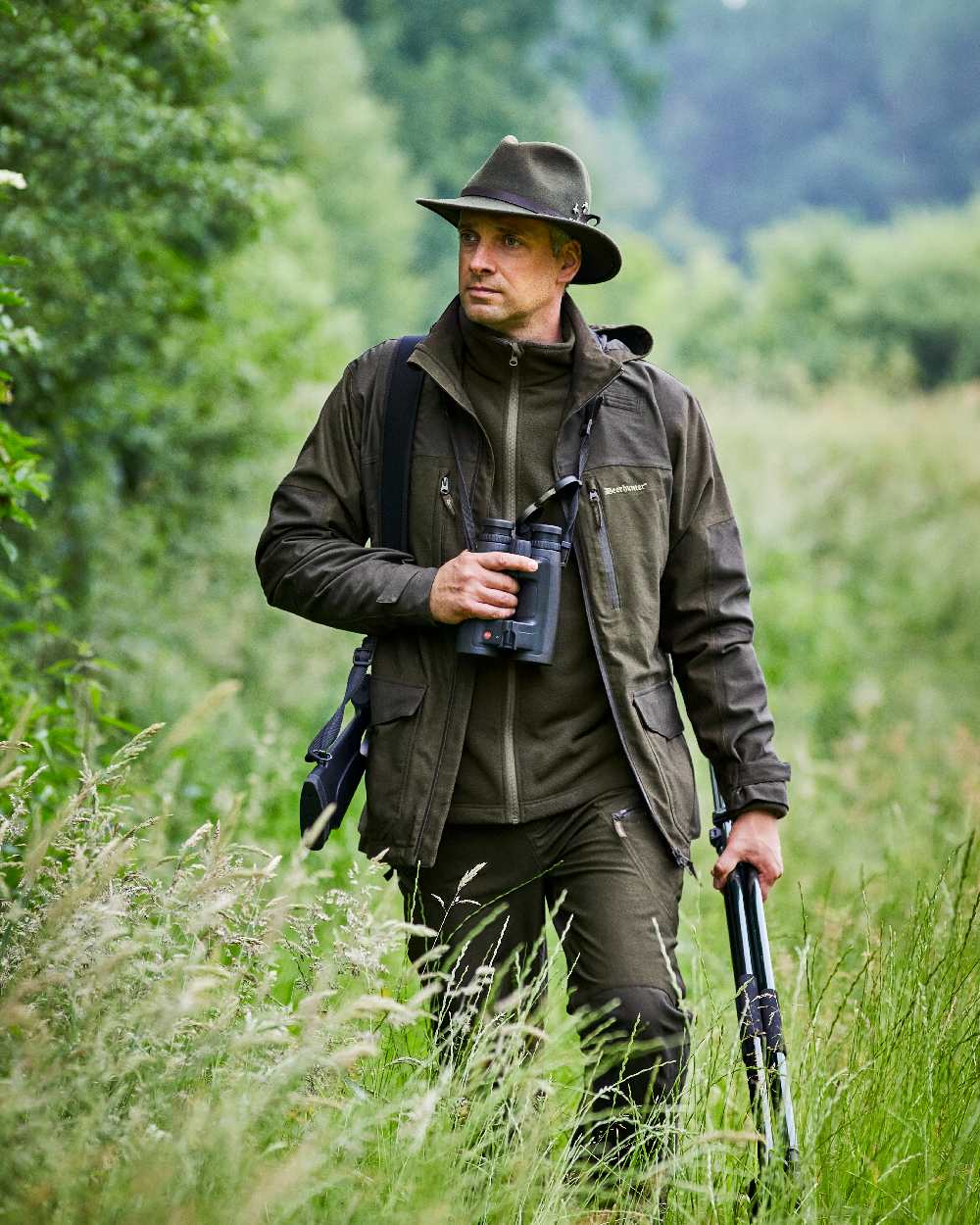 Olive Green Melange Coloured Deerhunter Chasse Jacket on forest background