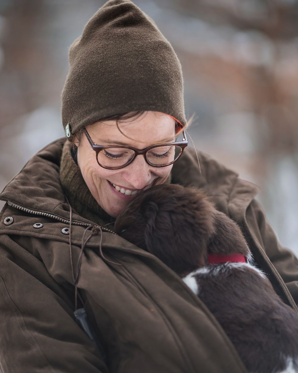 Orange Green coloured Deerhunter Cumberland Reversible Beanie on blurry background