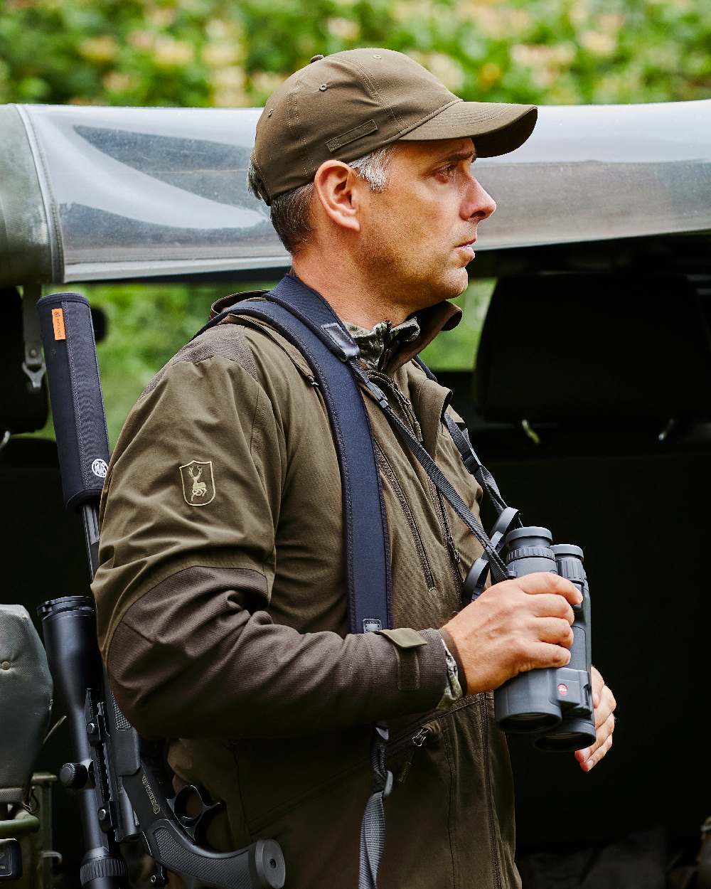Art Green coloured Deerhunter Excape Light Jacket on jeep background
