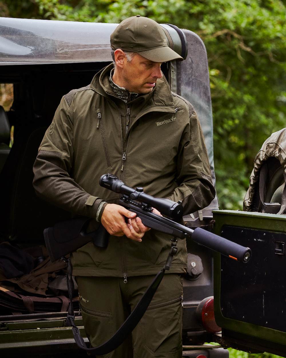 Art Green coloured Deerhunter Excape Light Jacket on jeep background