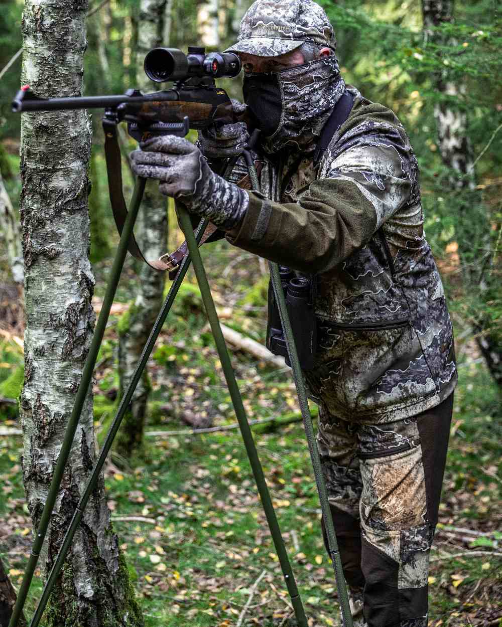 Realtree Excape coloured Deerhunter Excape Light Trousers on forest background