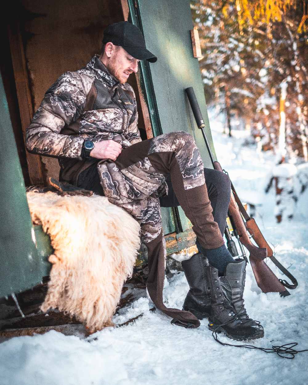 Realtree Excape coloured Deerhunter Excape Quilted Trousers on snow background