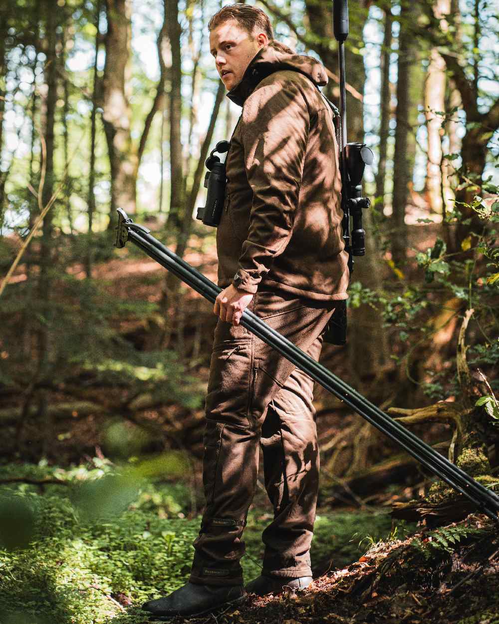 Art Green coloured Deerhunter Excape Softshell Jacket on forest background