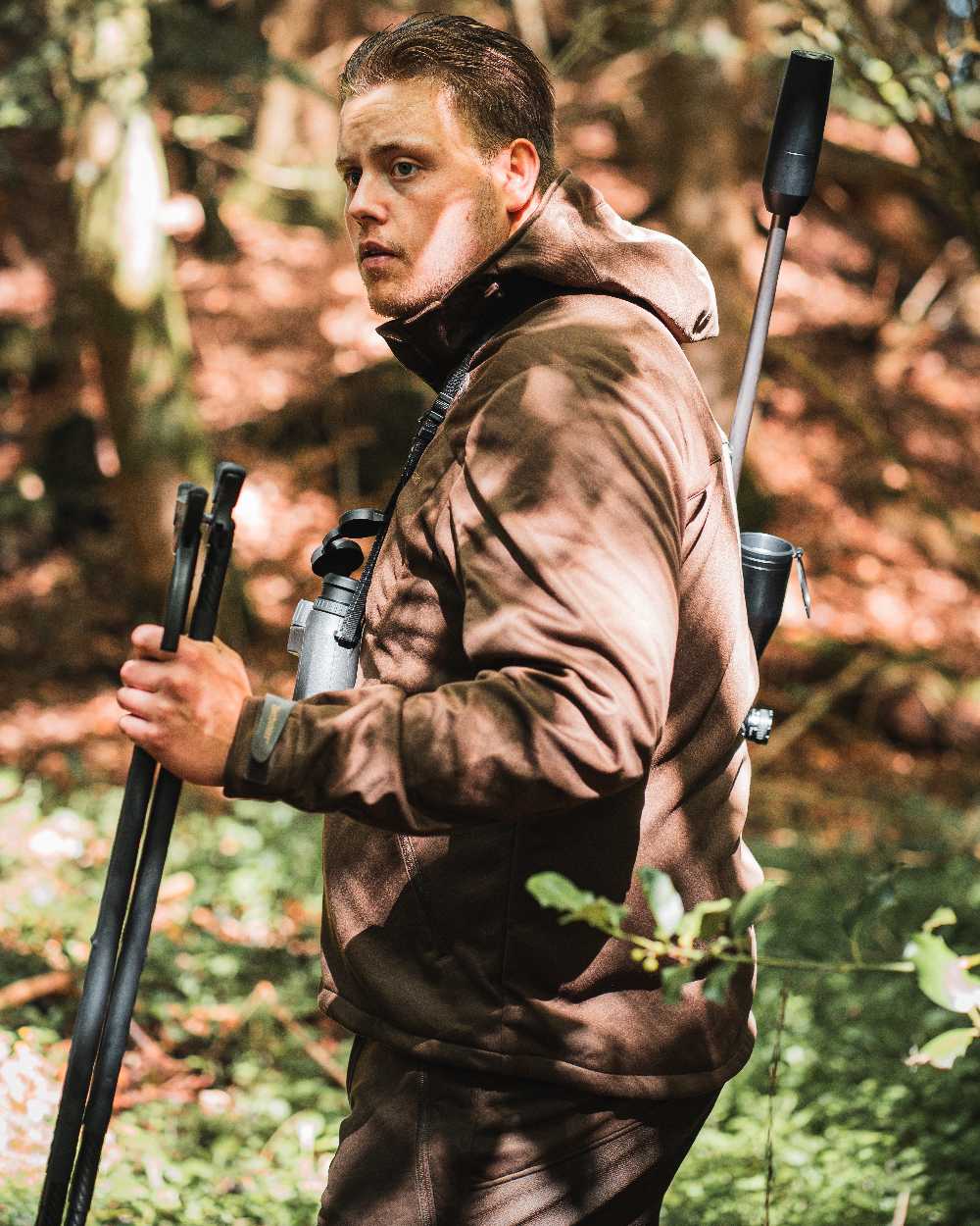 Art Green coloured Deerhunter Excape Softshell Jacket on forest background