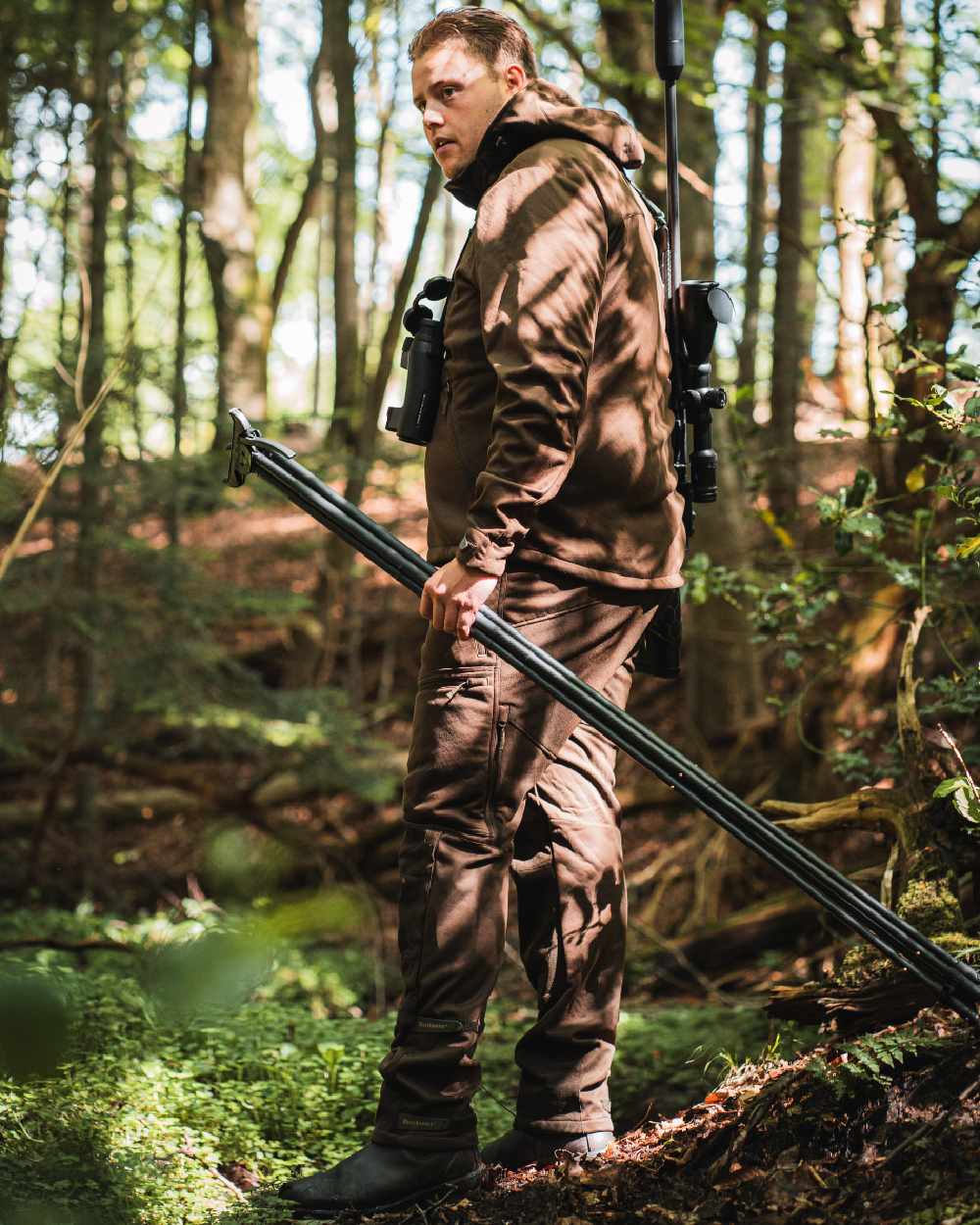 Art Green coloured Deerhunter Excape Softshell Trousers on forest background