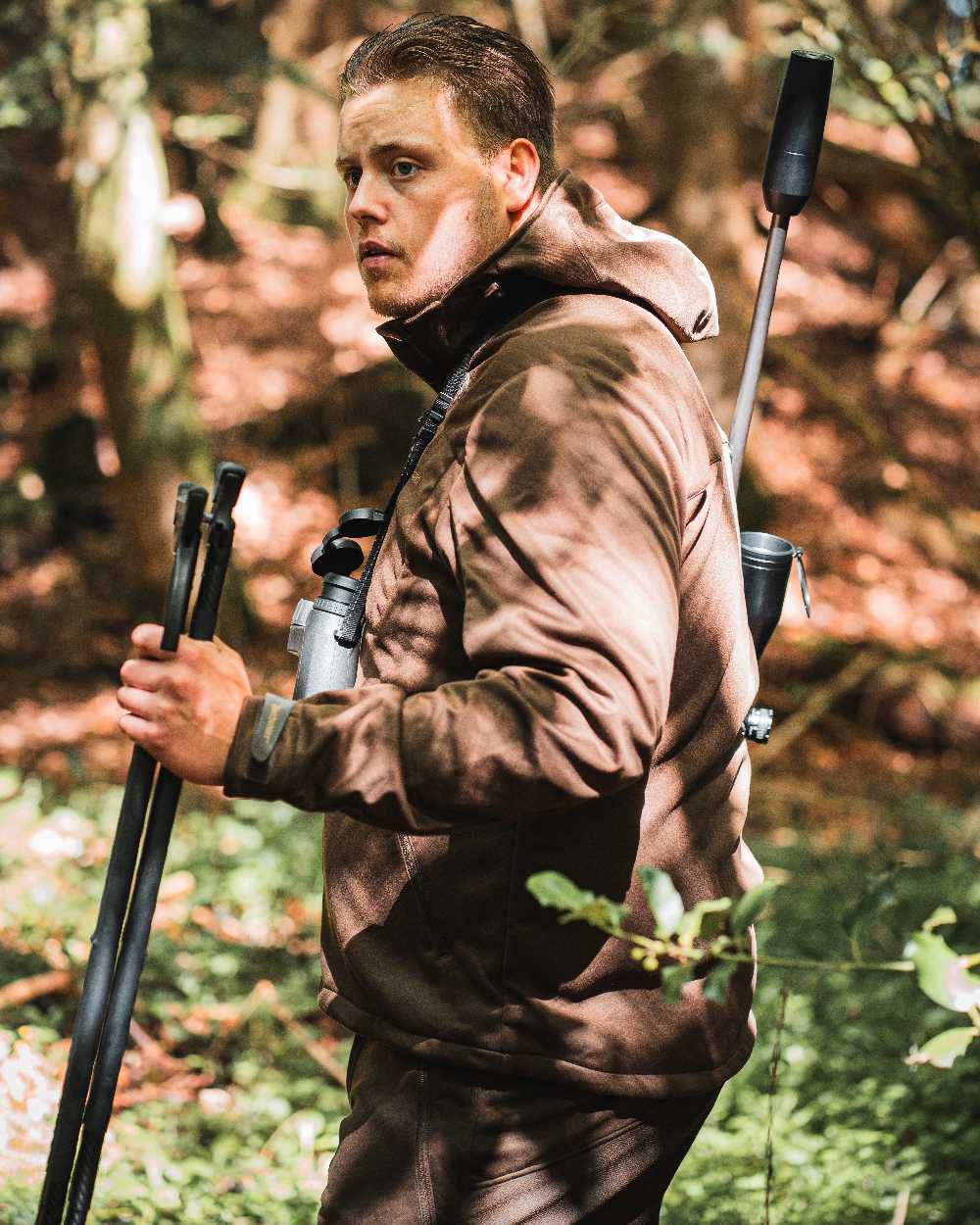 Art Green coloured Deerhunter Excape Softshell Trousers on forest background