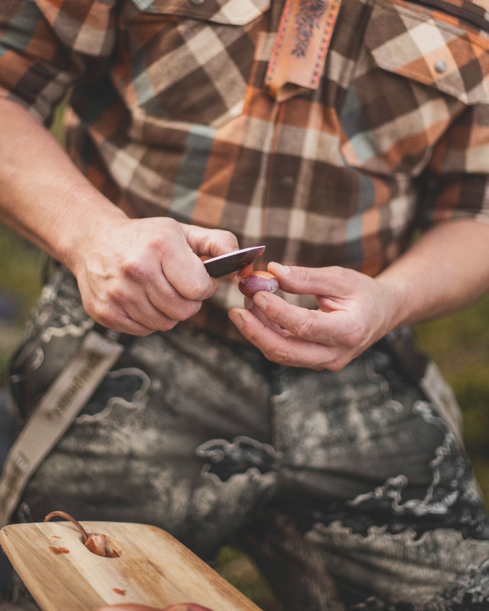 Realtree Excape coloured Deerhunter Excape Softshell Trousers on blurry background