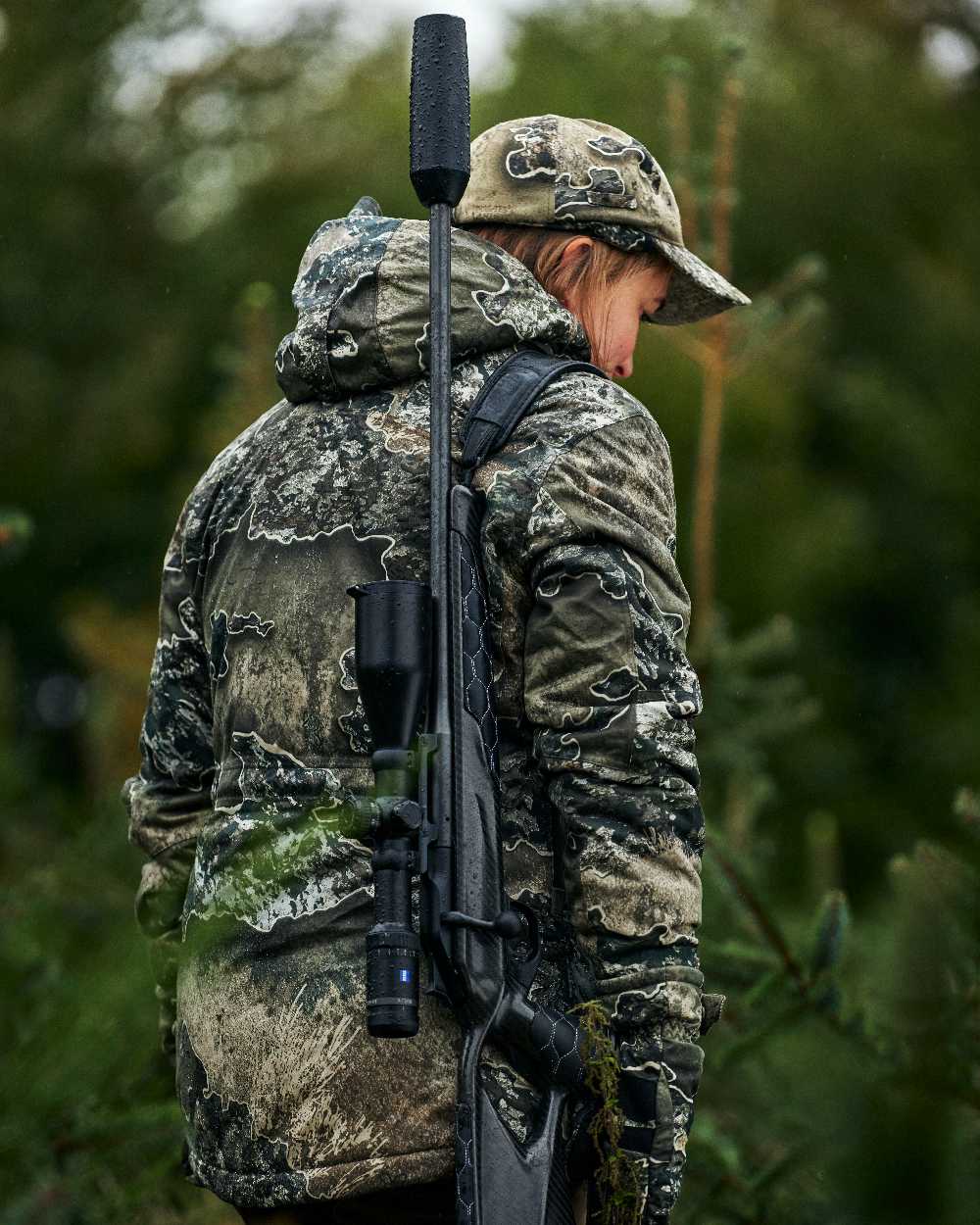 Realtree Excape coloured Deerhunter Excape Winter Cap on blurry background