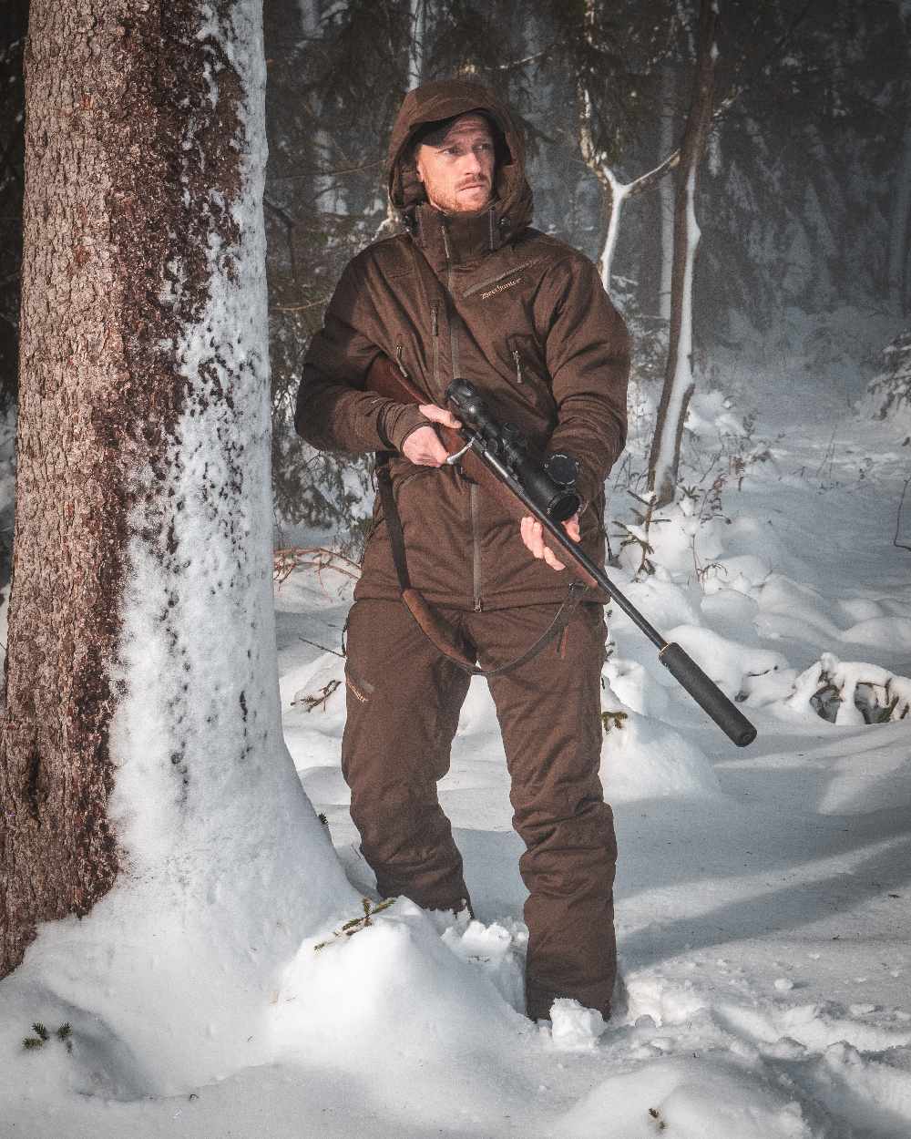 Art Green coloured Deerhunter Excape Winter Waterproof Jacket on snow background