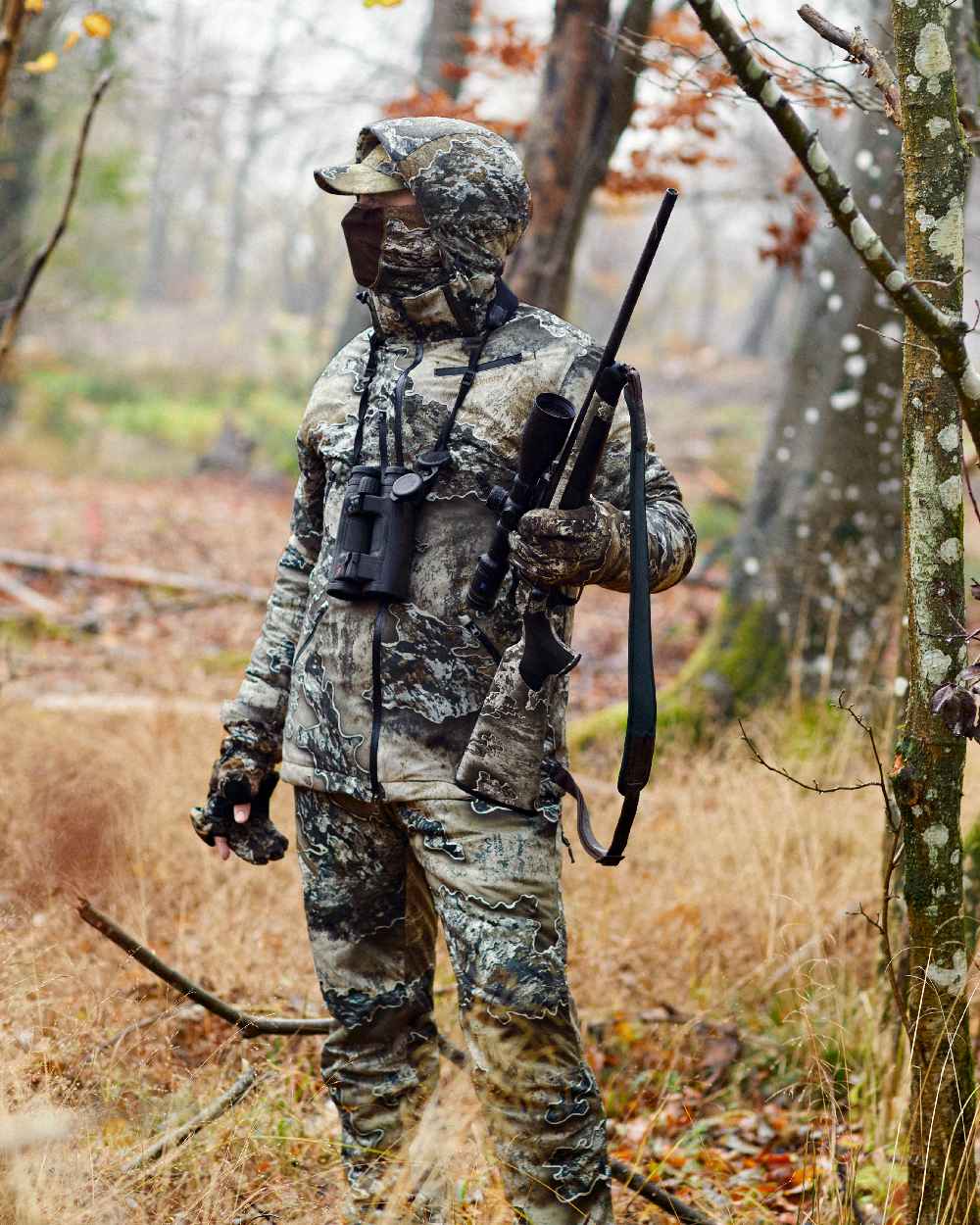 Realtree Excape coloured Deerhunter Excape Winter Waterproof Jacket on forest background