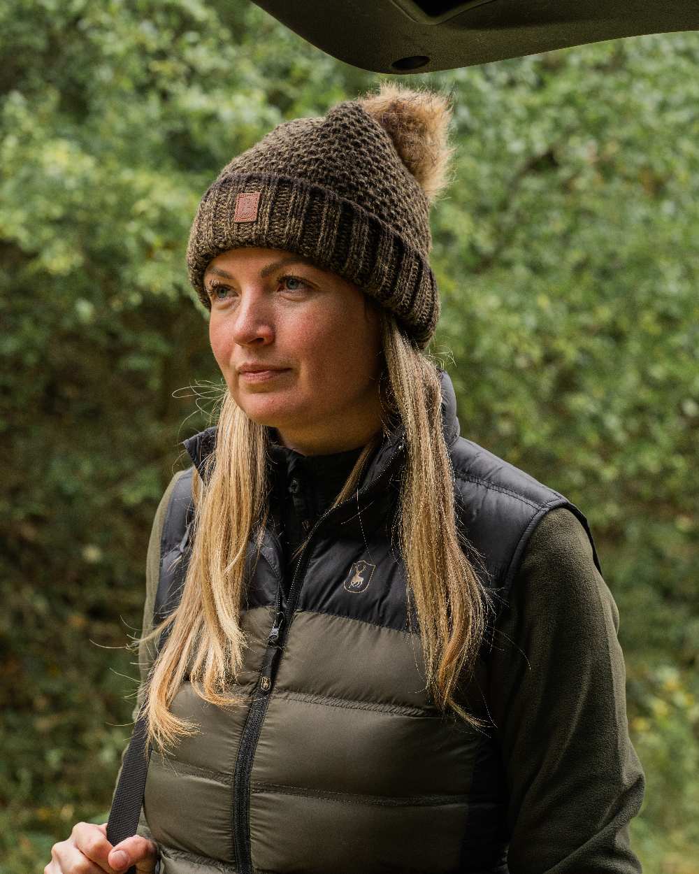 Art Green coloured Deerhunter Ladies Knitted Hat on blurry background