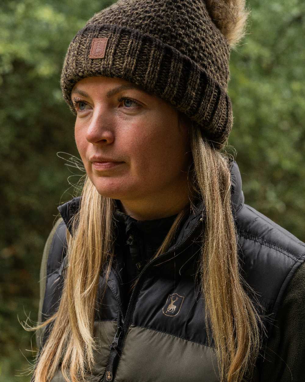 Art Green coloured Deerhunter Ladies Knitted Hat on blurry background