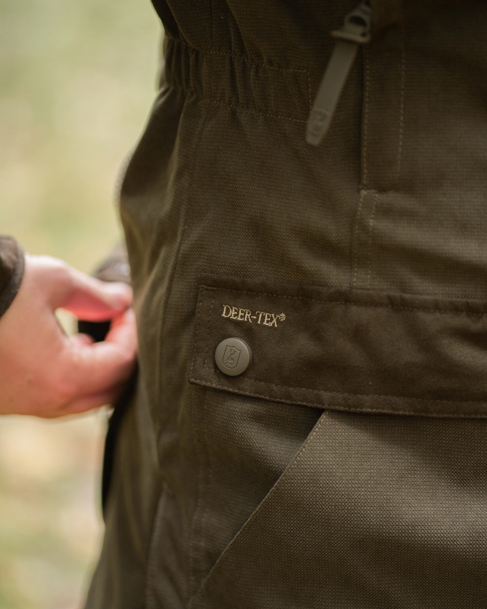Tarmac Green coloured Deerhunter Lady Eagle Winter Jacket on blurry background