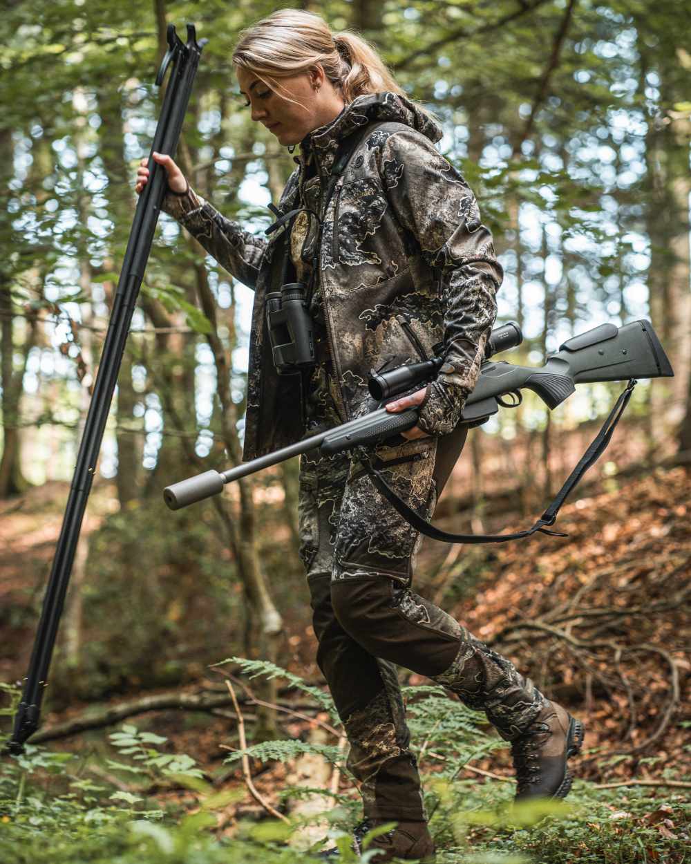 Realtree Excape coloured Deerhunter Lady Excape Softshell Trousers on forest background