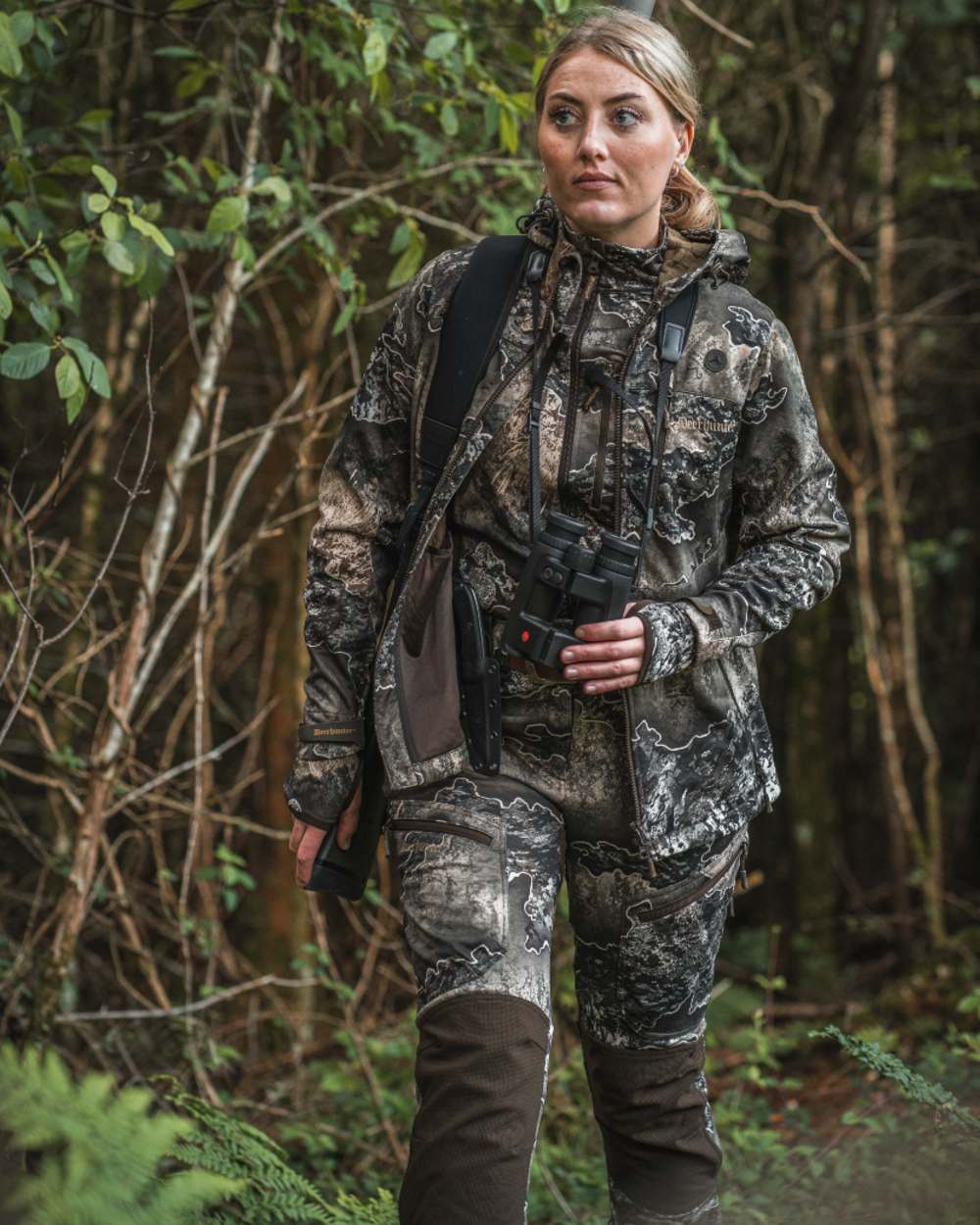 Realtree Excape coloured Deerhunter Lady Excape Softshell Trousers on forest background