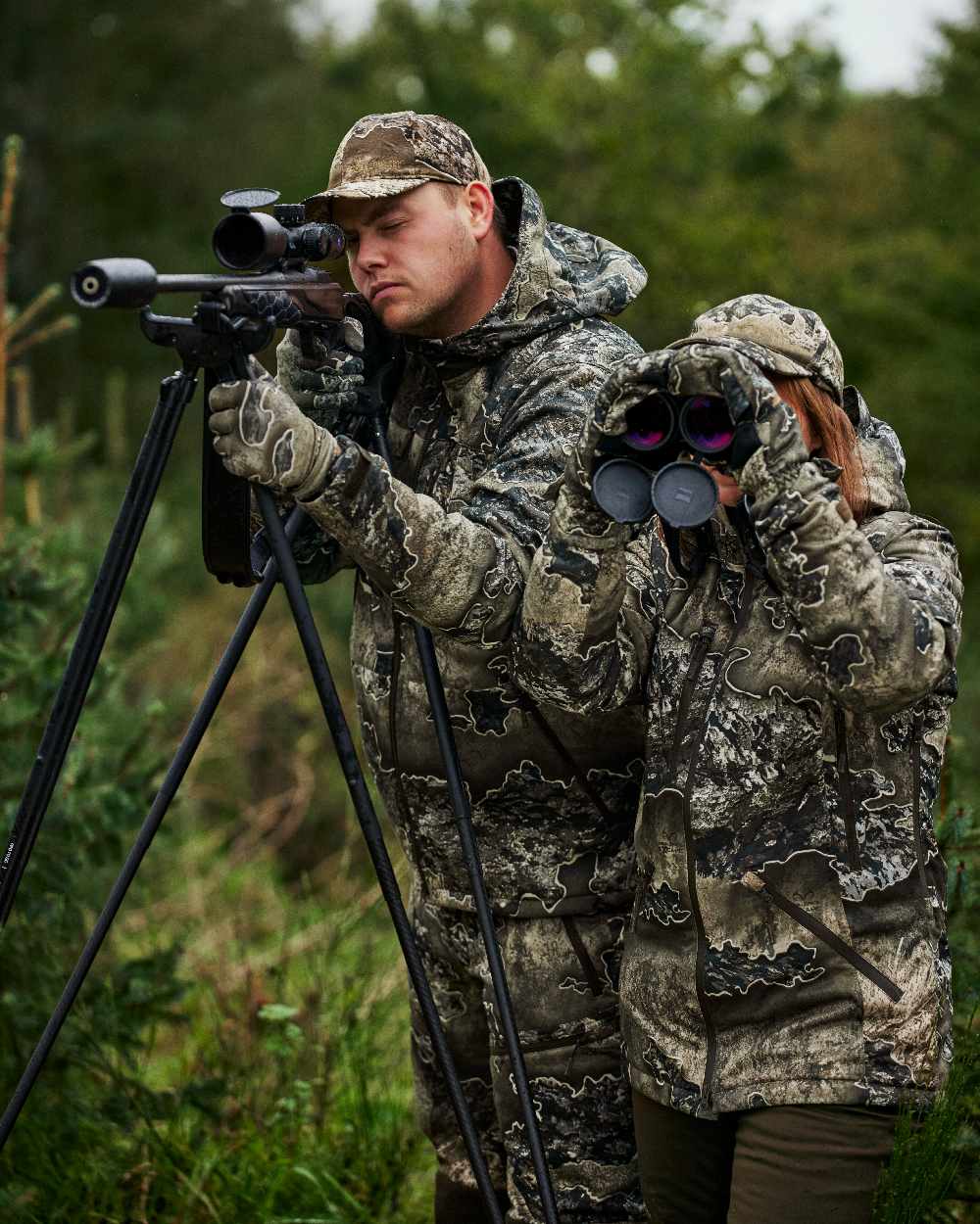 Art Green coloured Deerhunter Lady Excape Winter Trousers on forest background