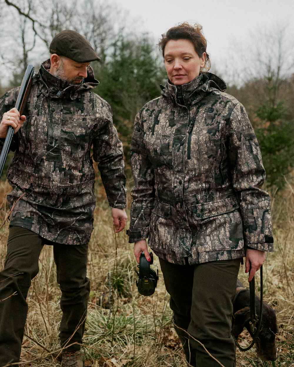 Peat coloured Deerhunter Lady Gabby Waterproof Boot Trousers on forest background