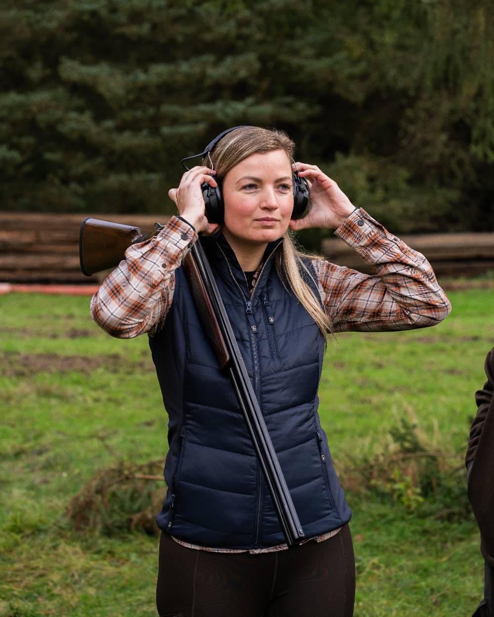 Dark Blue Coloured Deerhunter Lady Heat Padded Waistcoat on forest background