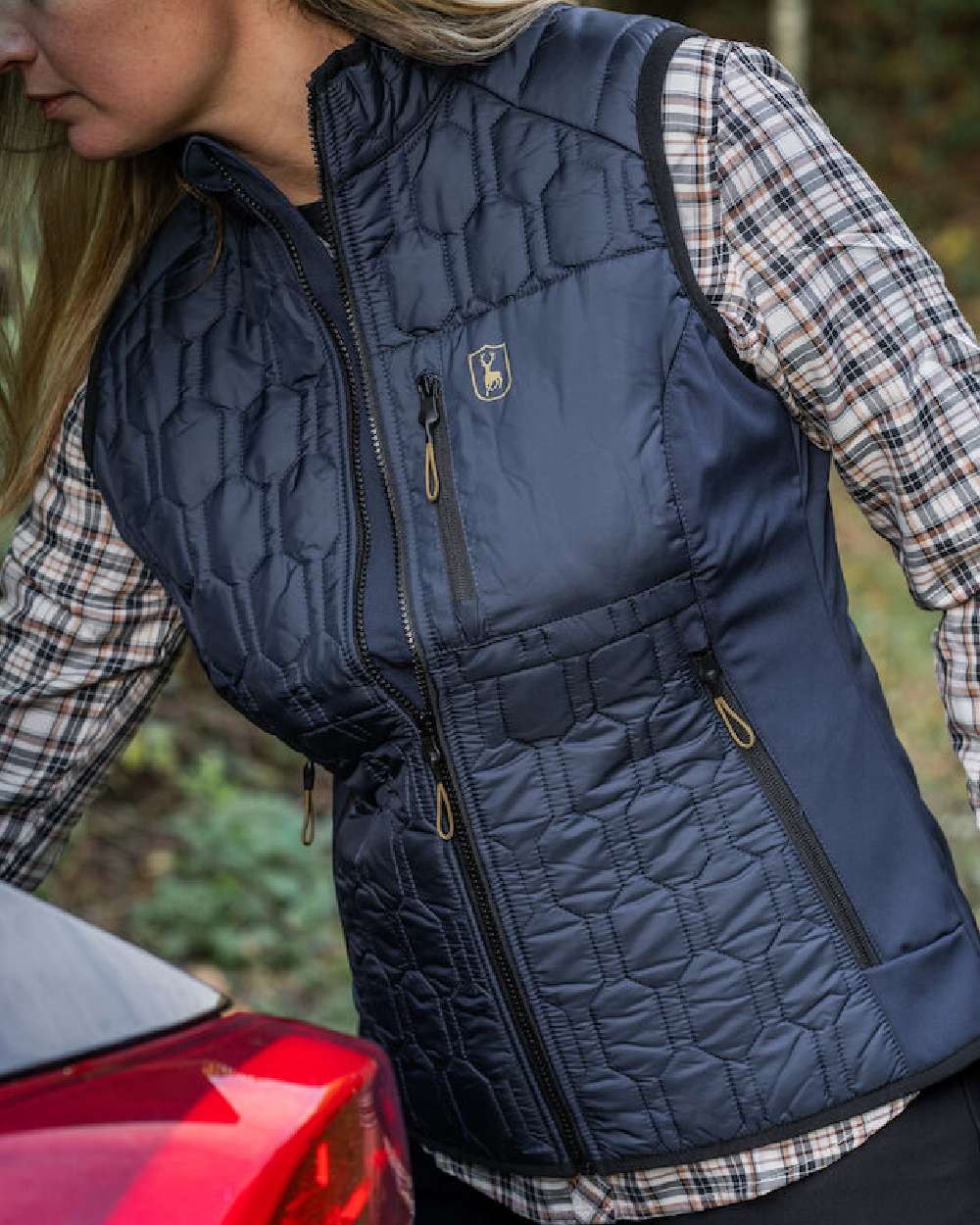 Dress Blue coloured Deerhunter Lady Mossdale Quilted Waistcoat on forest background