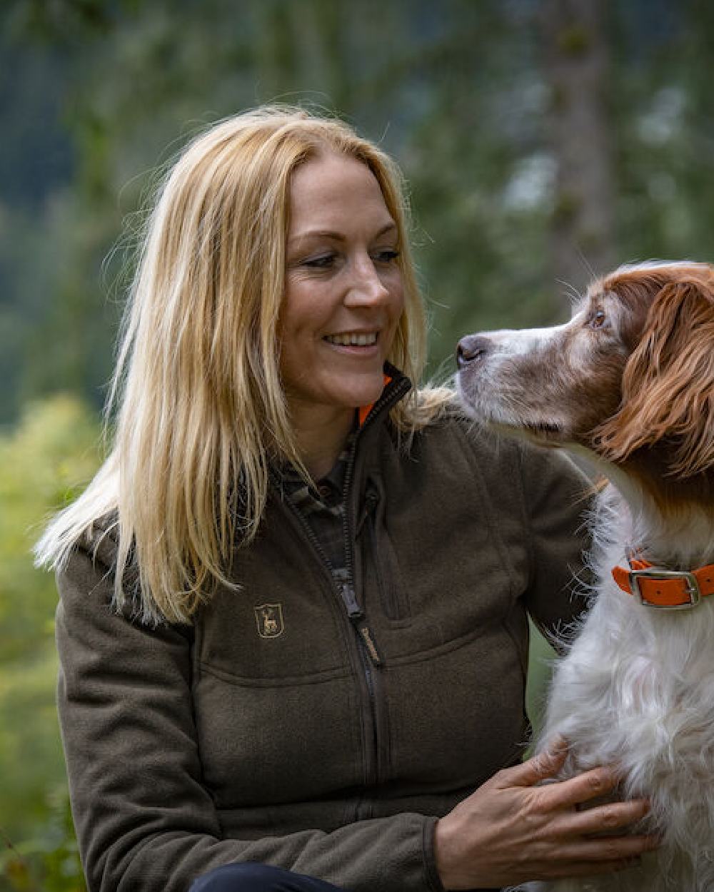 Green Orange coloured Deerhunter Lady Pam Reversible Bonded Fleece Jacket on forest background
