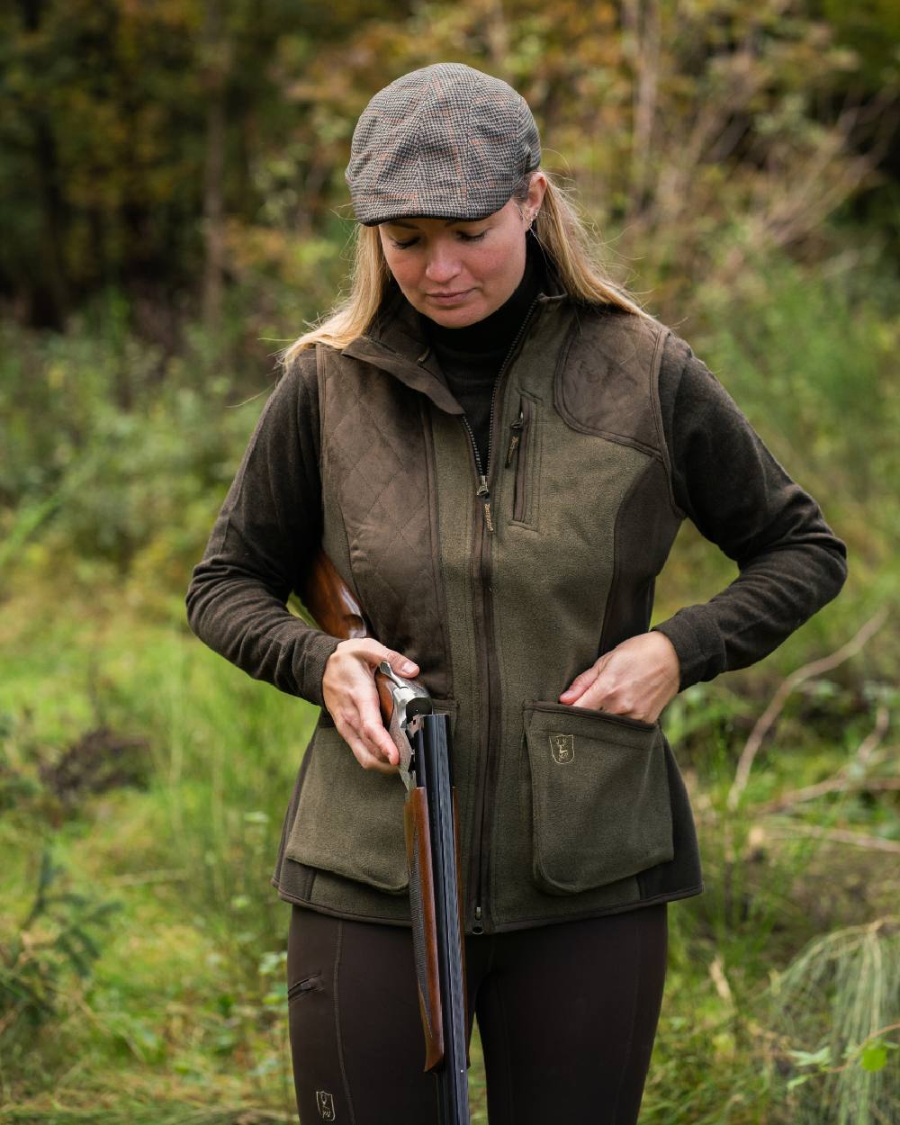 Graphite Green coloured Deerhunter Lady Pam Shooting Waistcoat on forest background