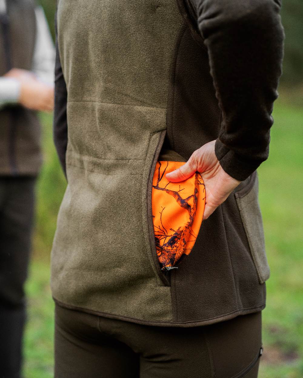 Graphite Green coloured Deerhunter Lady Pam Shooting Waistcoat on blurry background