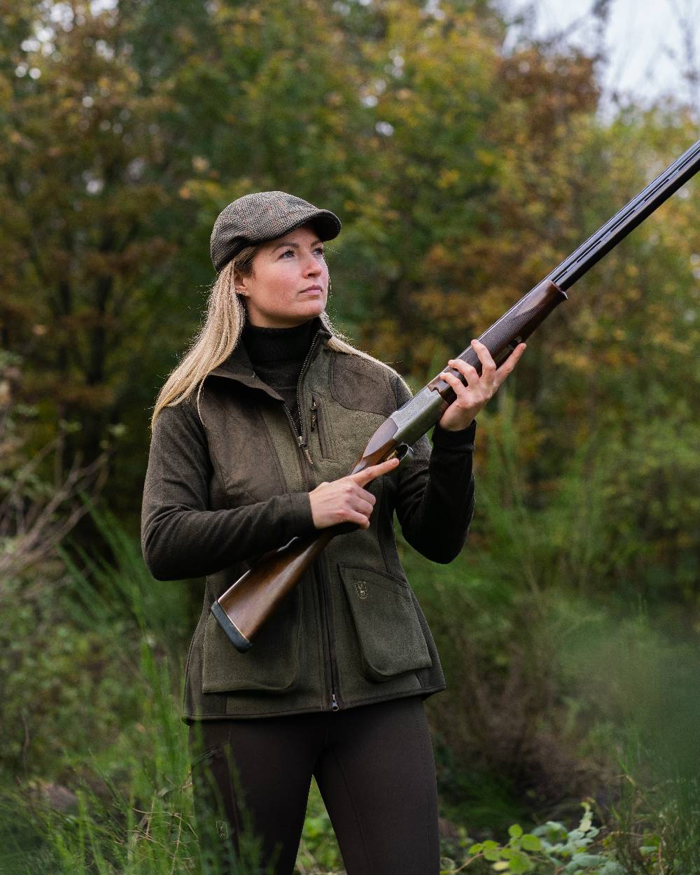Graphite Green coloured Deerhunter Lady Pam Shooting Waistcoat on forest background