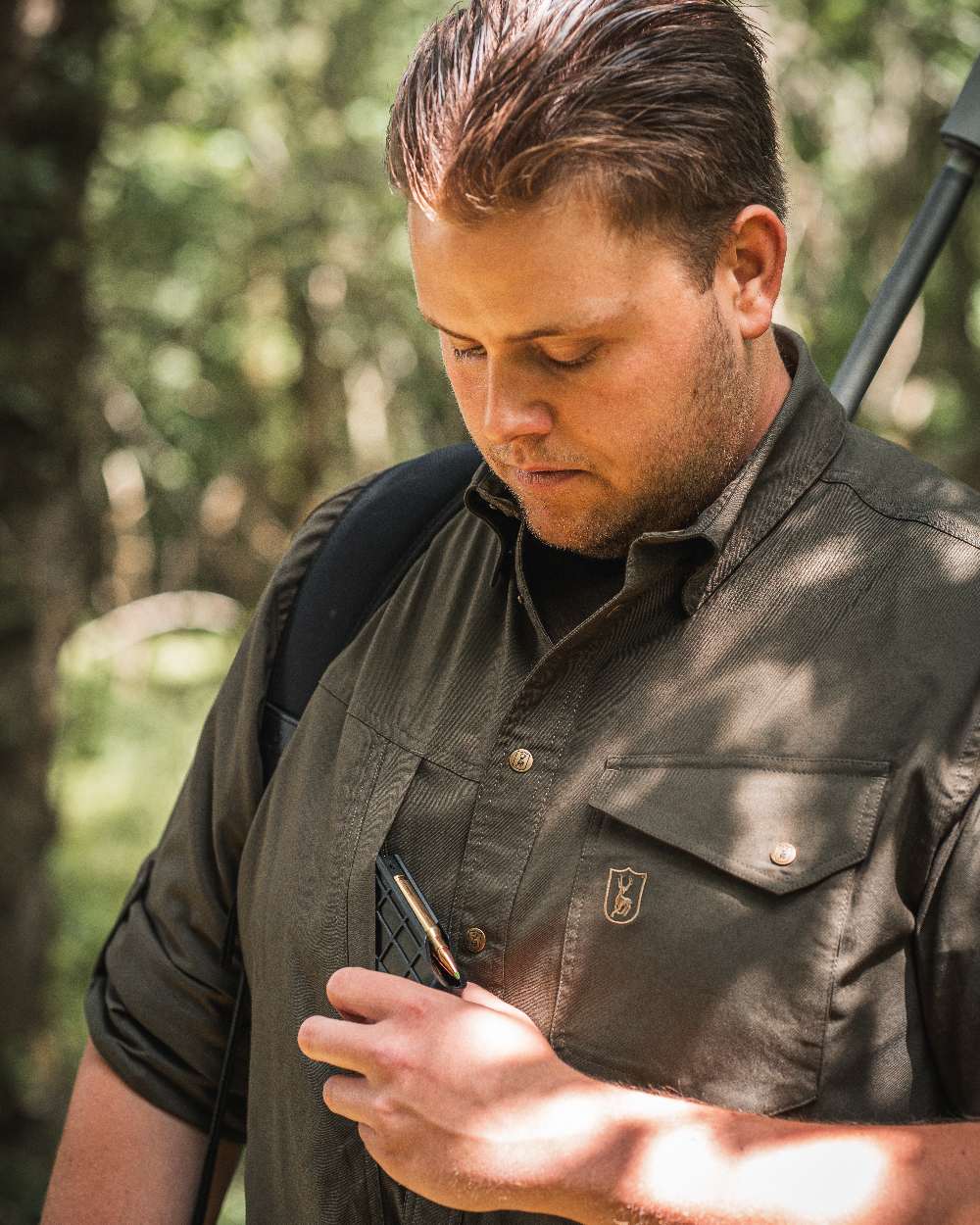 Forest Green coloured Deerhunter Matobo Shirt on blurry background