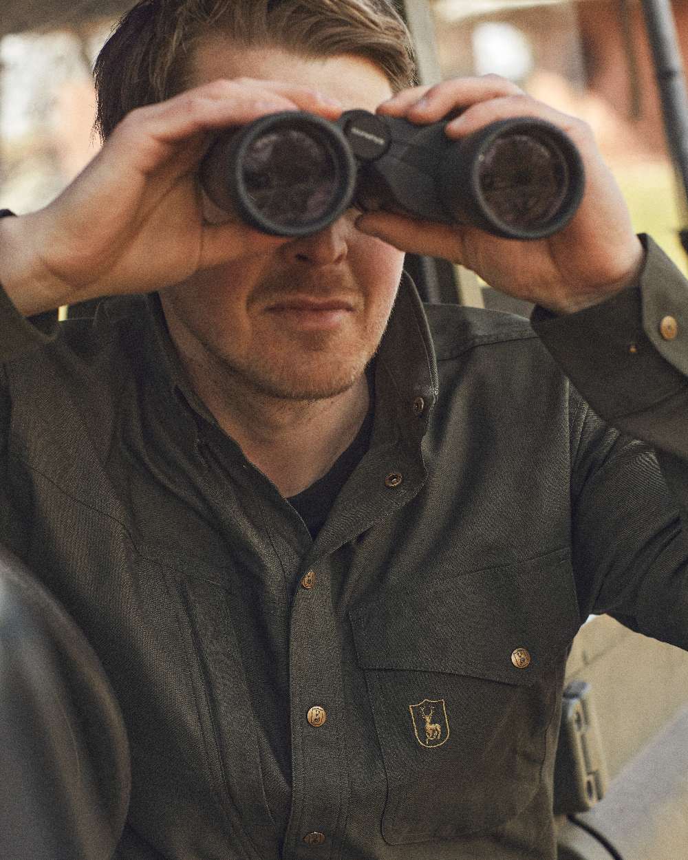Forest Green coloured Deerhunter Matobo Shirt on blurry background