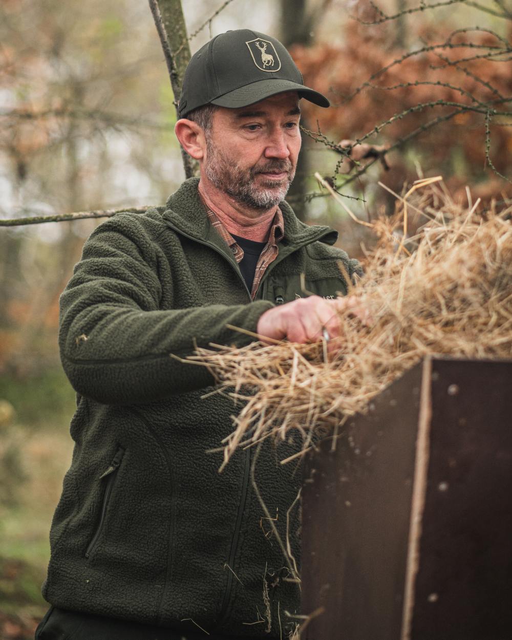 Forest Green coloured Deerhunter Atlas Fleece Jacket on forest background
